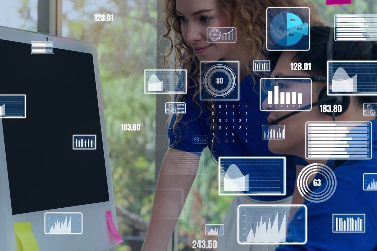 Team analyzing digital data and performance metrics on screen — ideal for media entertainment strategies and marketing for entertainment industry campaigns.